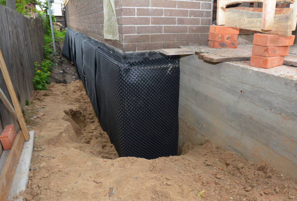 SJ Waterproofing Pros technician performing targeted Waterproofing assessment in Rome City, IN